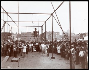 Crowd watching a gymnast at the Hudson Bank Gymnasium and Playground, 53rd Street and 11th Avenue, New York, 1898
