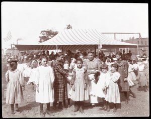 Group of girls and a woman at the Hudson Bank Gymnasium and Playground, 53rd Street and 11th Avenue, New York, 1898