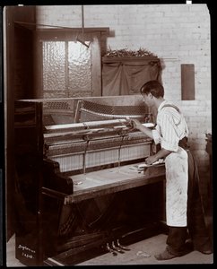 Man working in the Hardman, Peck and Co. piano factory, New York