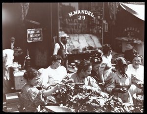 View of women shopping for vegetables from a peddler on Hester Street, New York, 1898