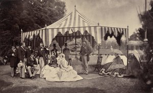 Group of Well-Dressed People in Front of an Outdoor Tent