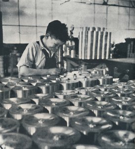 Apprentice with Microscope Testing the Hardness of Pistons, 1941