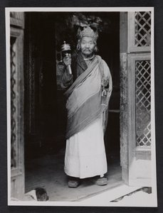 A Ngagpa Holding a Prayer Wheel