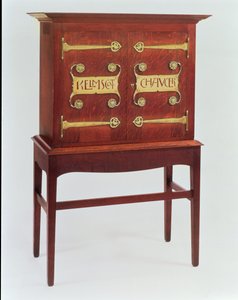 The Kelmscott Chaucer cabinet, designed by C.F.A.Voysey and made by F.Coote