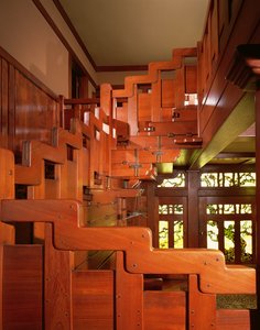 View of the Hand Railing of the Main Staircase with the Front Entryway in the Background by Charles & Henry (1870 1954) Greene