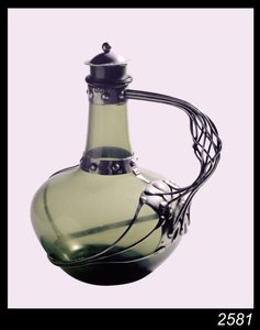 Silver-mounted green glass decanter with makers mark for the Guild of Handicraft, 1901 by Charles Robert Ashbee