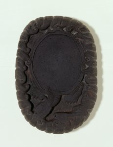 Inkstone carved as the large mythical Lo-shu tortoise among waves