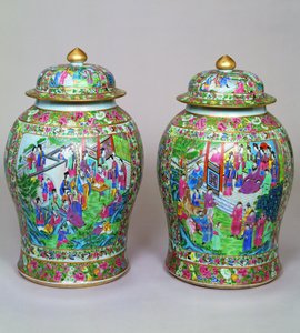 Pair of Canton famille rose baluster vases and domed covers, early 19th century