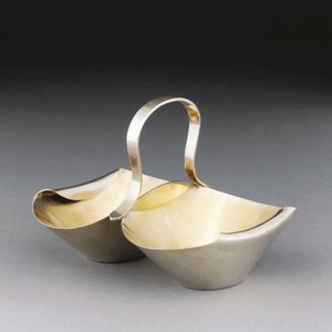 A White Metal Basket by Christopher Dresser