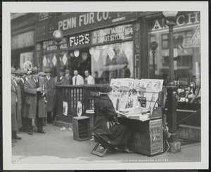 Blind news dealer, Fannie Lyons, at her stand at the southeast corner of 7th Avenue & 34th Street by Company Byron