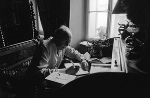 Jiri Mucha Sitting at His Desk in His House in Hradcany, Prague by Czech Photographer