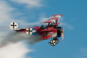 Historic Red Triplane Soaring by Darek Siusta