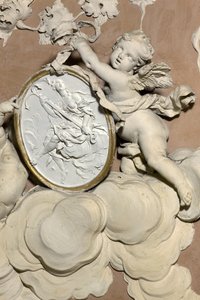 Angels holding a medallion