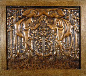 A decorative lead panel moulded in high relief, depicting two facing stylised maidens by Donald McKay Stoddart