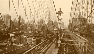 Lower Manhattan Viewed Through The Network Of Cables On Brooklyn Suspension Bridge, c1930 by ENA
