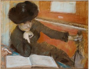 Woman Sitting in Front of a Piano