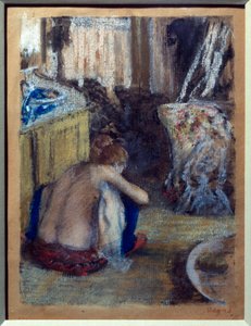 Woman squatting by Edgar Degas