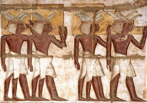 Egyptian antiquity: first court, detail of painted reliefs representing a group of Nubians bringing offerings to the pharaoh. Funeral Temple of Ramses III by Egyptian 20th Dynasty