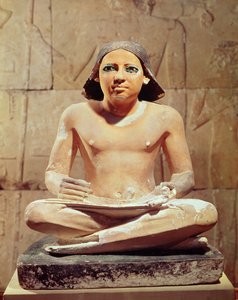 Scribe seated cross-legged holding a papyrus scroll, from Saqqara, Old Kingdom