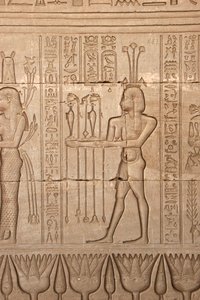 Egyptian antiquity: representation of a man bringing offerings as homage to the goddess, Temple of Hathor, Denderah, Egypt by Egyptian Ptolemaic Period
