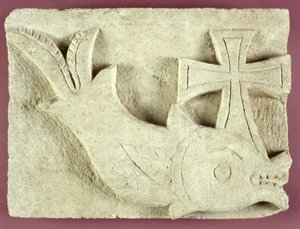 Relief of a dolphin carrying a cross