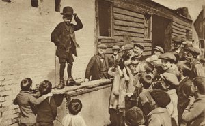 A Budding Humorist of the East End Doing a Charlie Chaplin Impression by English Photographer