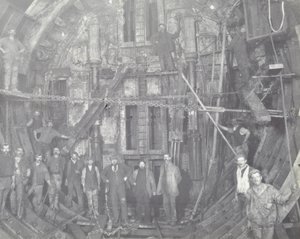 Blackwall Tunnel: A Group of Workers Stand in the Air Lock, 1894 by English Photographer