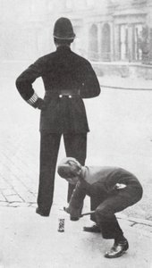 Boy Playing a Prank on a Policeman by English Photographer