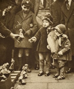 Children crowding round a street hawker, Holborn by English Photographer