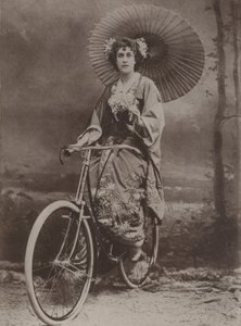 Girl on bicycle, dressed in the Japanese fashion by English Photographer