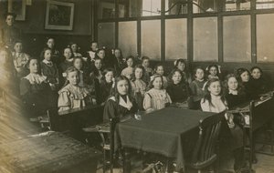 Girls Sitting in a Classroom by English Photographer