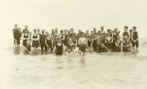 Large group of swimmers standing in the water