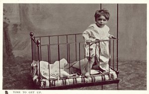 Little boy in a crib by English Photographer