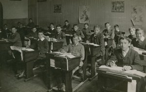 Male Pupils Sitting Behind Their Desks During a Lesson at School by English Photographer
