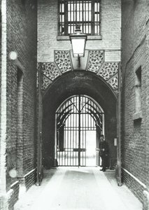 Millbank Prison: main passageway, Warden Barnard in doorway by English Photographer