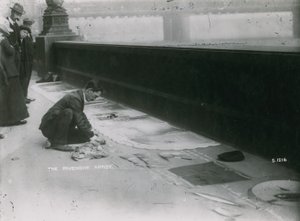 People Watching a Pavement Artist Drawing in Chalk