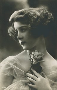 Portrait of a beautiful young woman with a rose by English Photographer