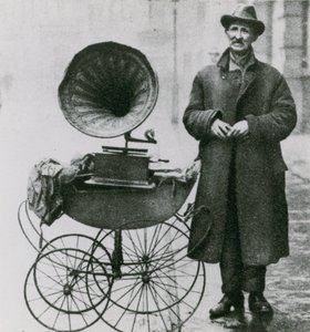 Untitled photograph of man with a phonograph in a pram