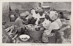 Women peeling kola nuts, Nigeria by English Photographer