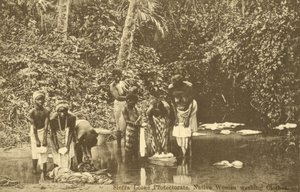 Women washing clothes in a river, Sierra Leone by English Photographer