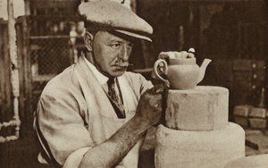 Worker producing a teapot at the Royal Doulton works, Stoke-on-Trent, Staffordshire by English Photographer