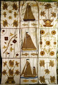 A Quilted Bed Spread of Sailing Ships and Flowers