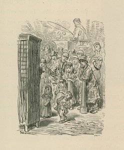 A crowd gather to watch a street entertainer