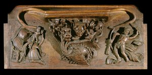 A misericord depicting an elaborately carved hydra, symbolic of the seven deadly sins, incorporating a realistic human head, New College Chapel, Oxford, late 14th century