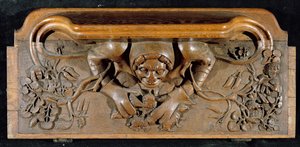 A misericord depicting an ogre with enormous shoulders, New College Chapel, Oxford, late 14th century