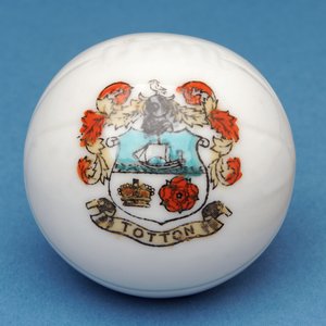 Armorial souvenir miniature football with transfer of the Totton crest (ceramic) by English School