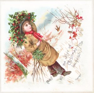 Boy carrying holly