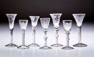Collection of engraved glasses with opaque and air twist stems by English School