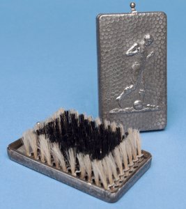 Folding hairbrush with a footballer design