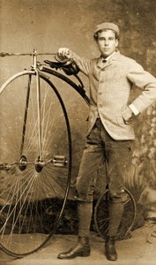 Man standing next to his Penny-Farthing, c.1890